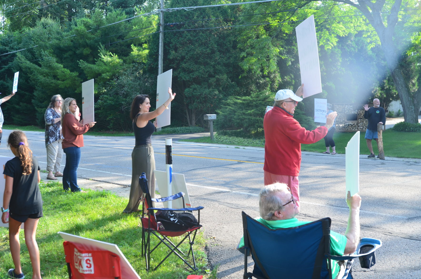 Waving at passing cars
